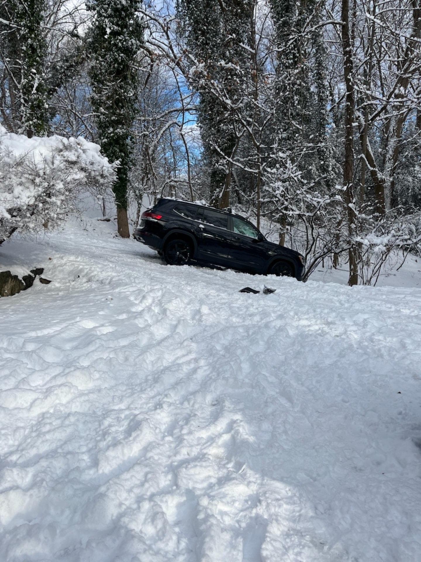 Vehicle recovery service helping a car stuck in snow in New Jersey