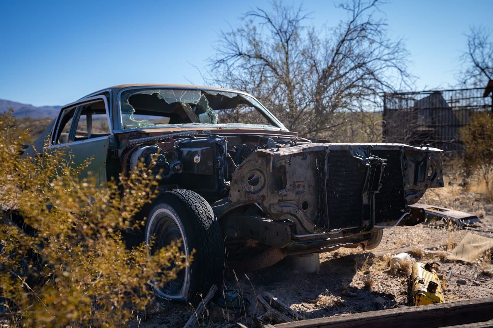 Damaged abandoned vehicle ready for junk car removal and hauling