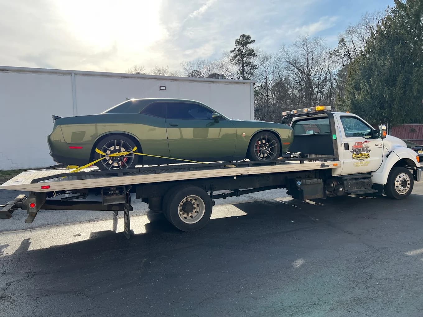Dodge Challenger Hellcat muscle car on Road Heroes flatbed tow truck